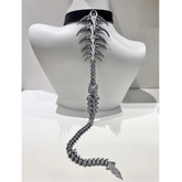 Metallic spine-like necklace on a mannequin bust